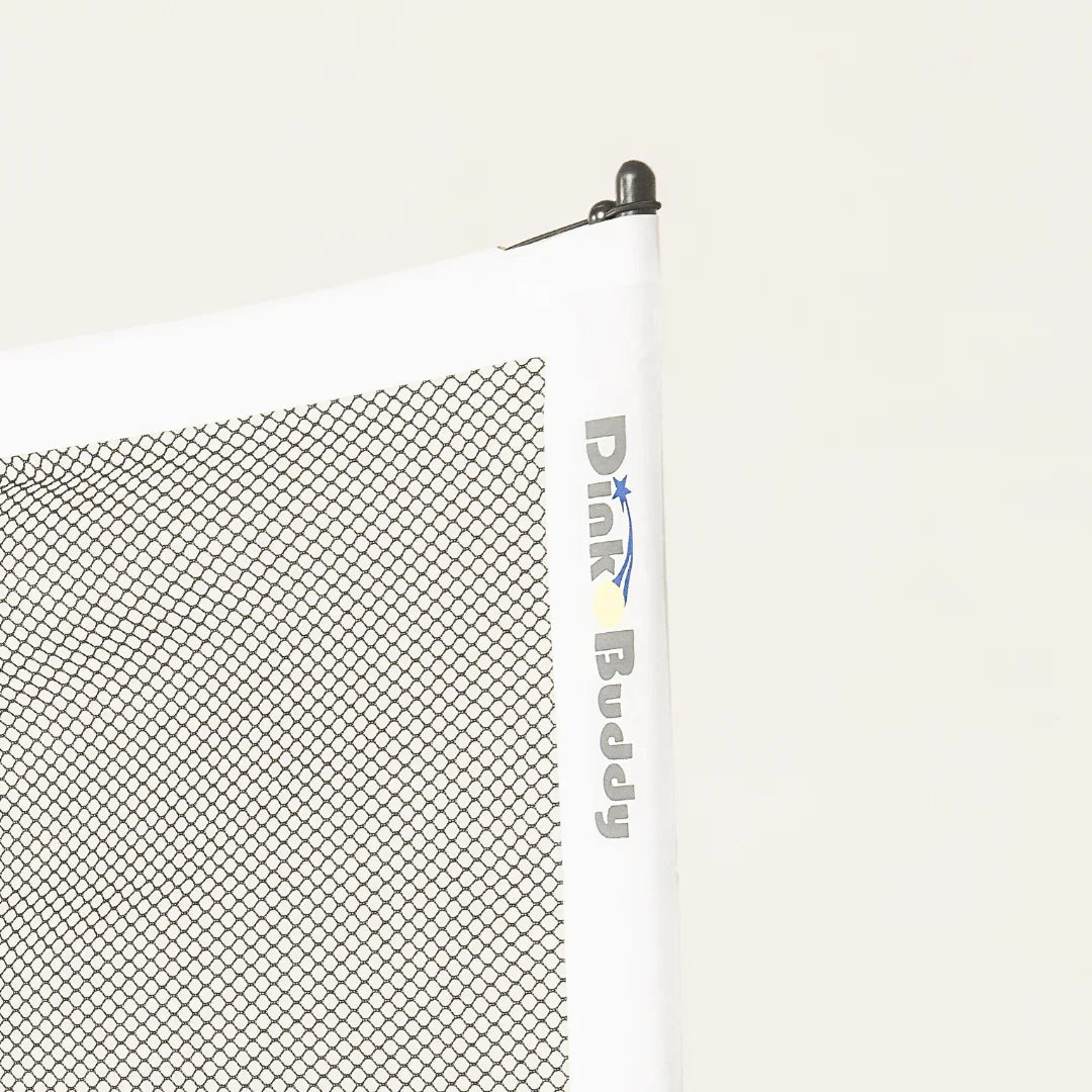 Dink Buddy pickleball net with white edging and black mesh on light background