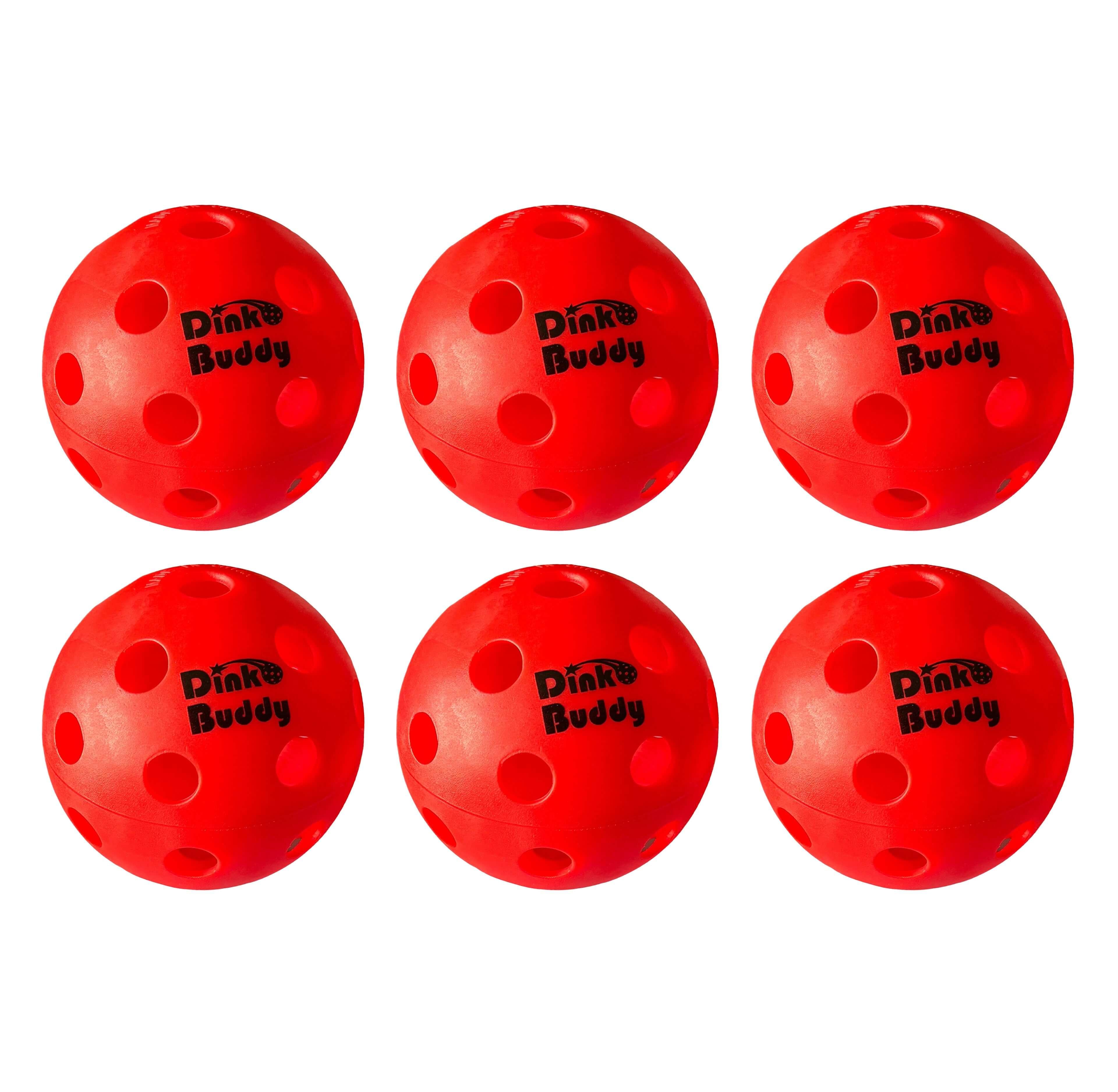 Six red Dink Buddy pickleball balls with holes, arranged on a white background
