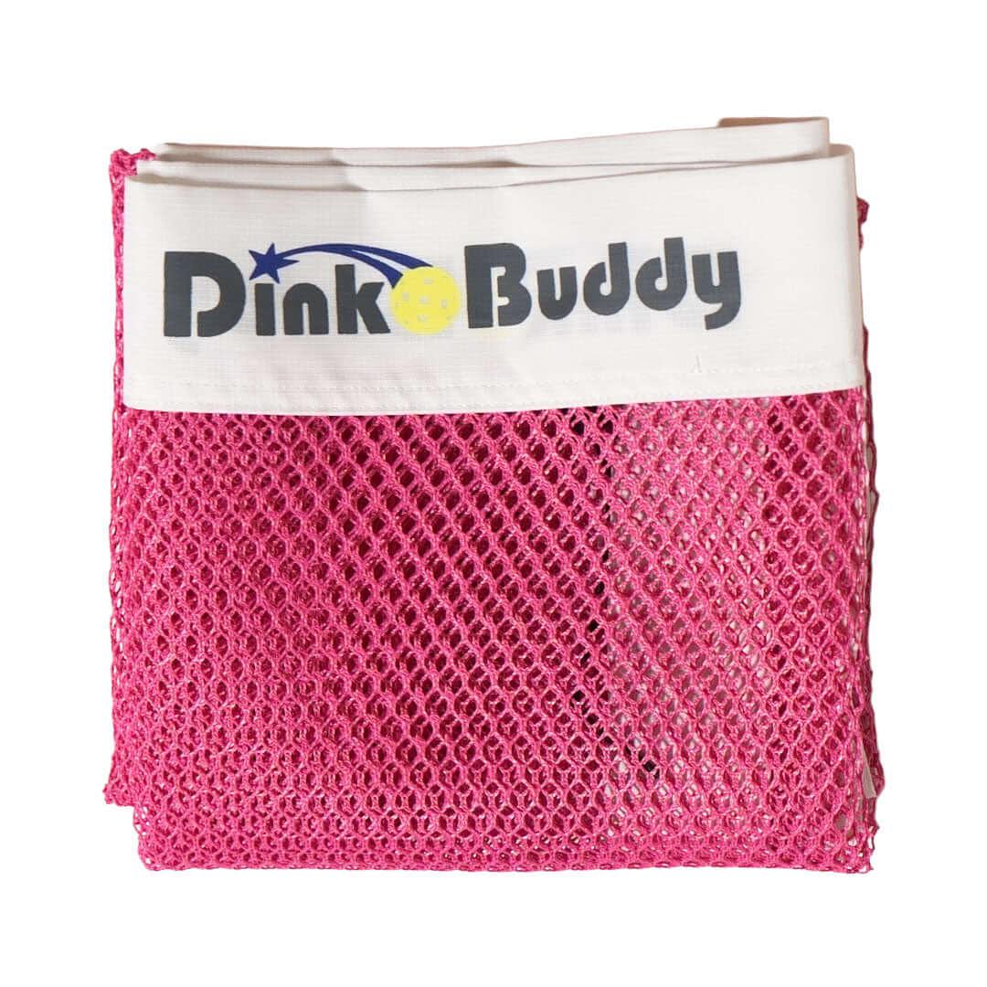 Folded pink mesh pickleball net with DinkoBuddy logo on white band