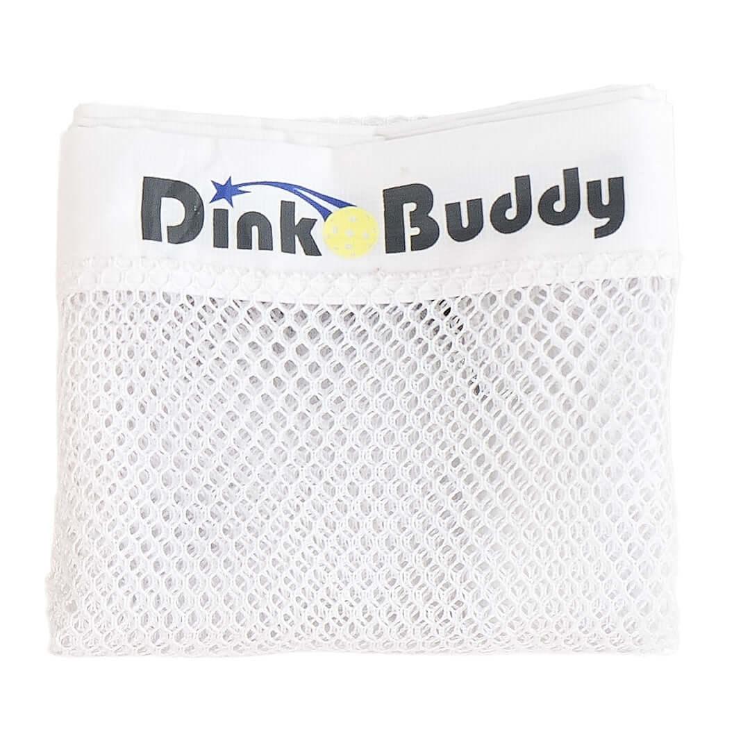 Folded white Dink Buddy pickleball net with mesh design on white background